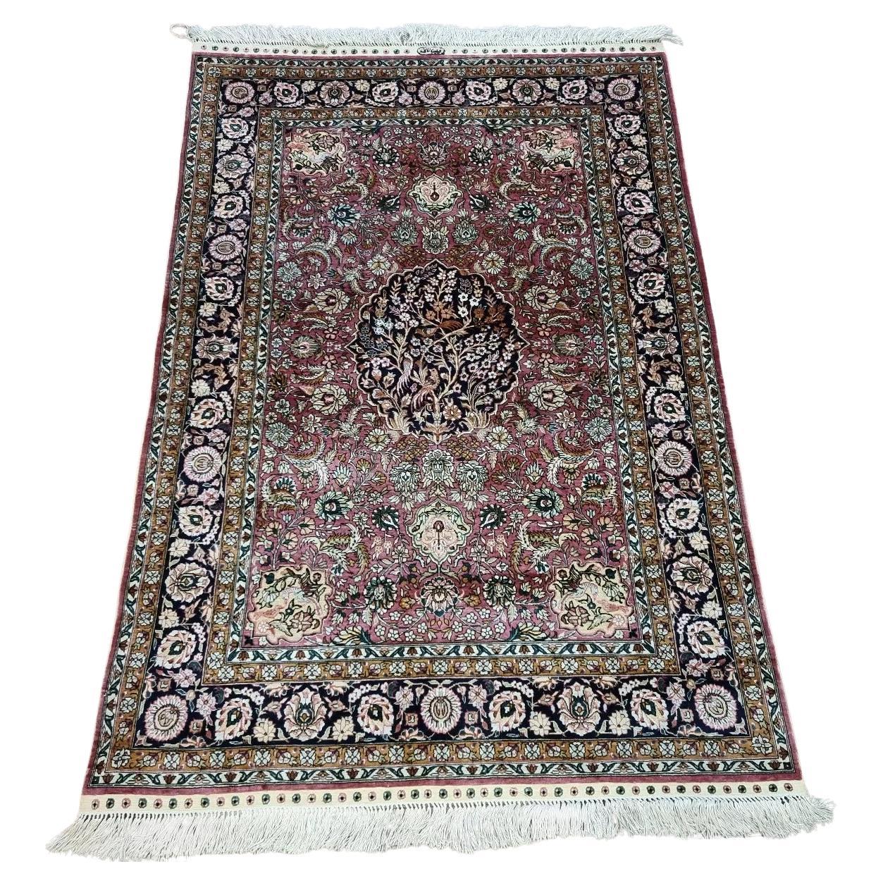 Handmade vintage Chinese Qum silk rug with floral design, full view.
