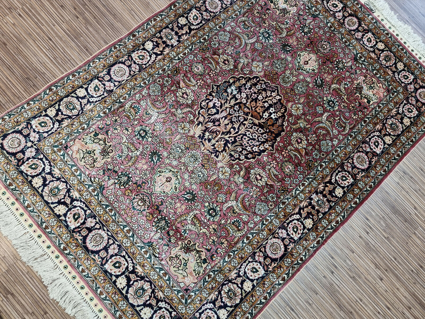 Corner detail showing the border design of Chinese Hereke silk rug.
