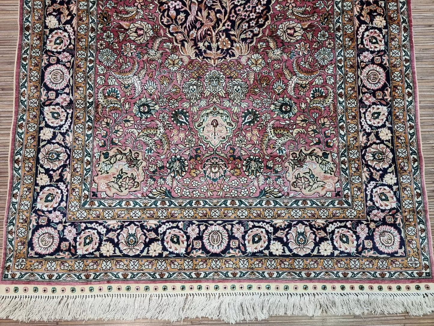 Backside of the Qum silk rug displaying its immaculate quality.
