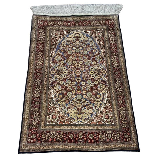 Handmade Turkish Hereke silk rug with intricate multicolor patterns.
