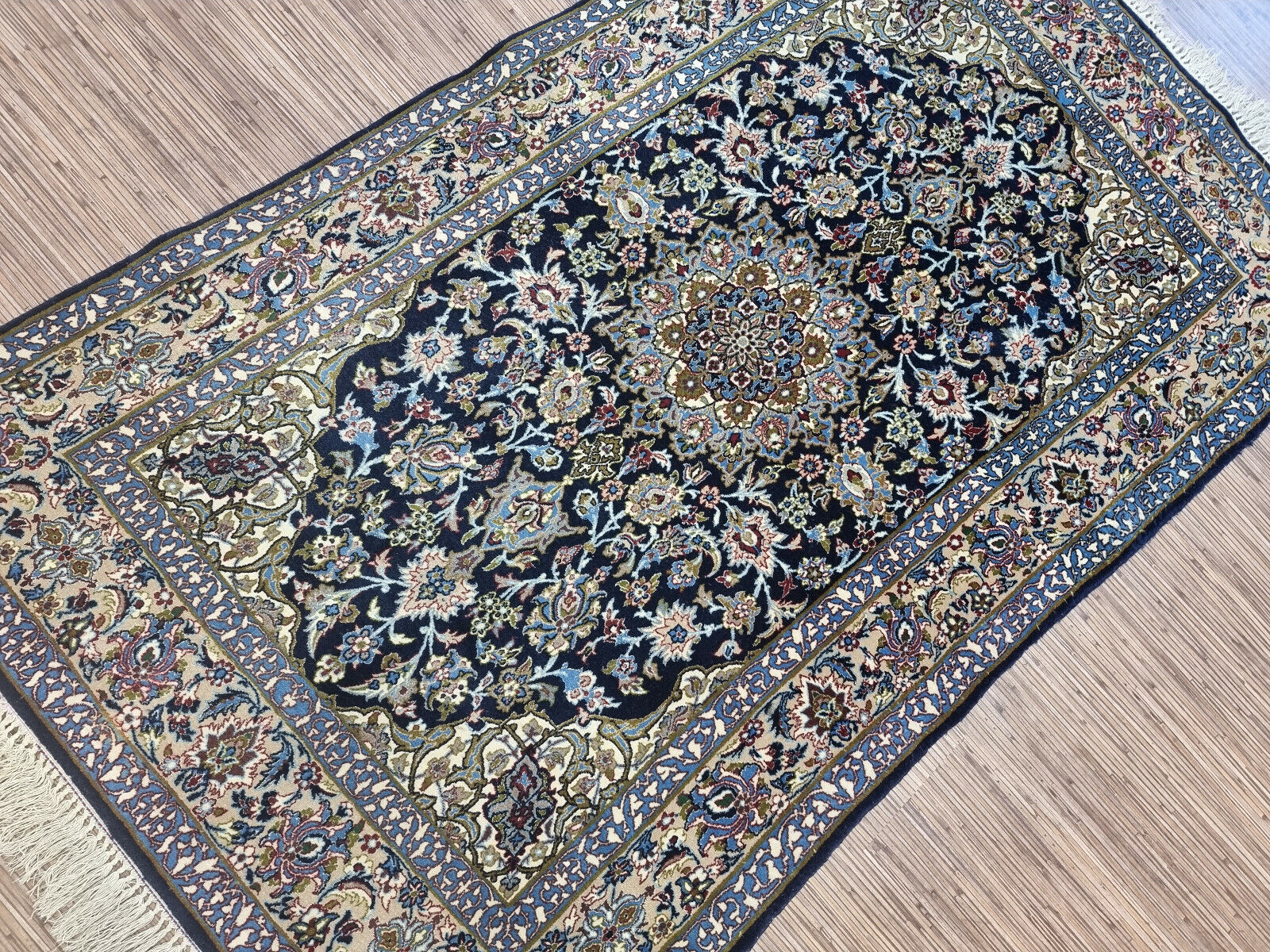 The elegant floral and geometric patterns of a Persian Isfahan carpet
