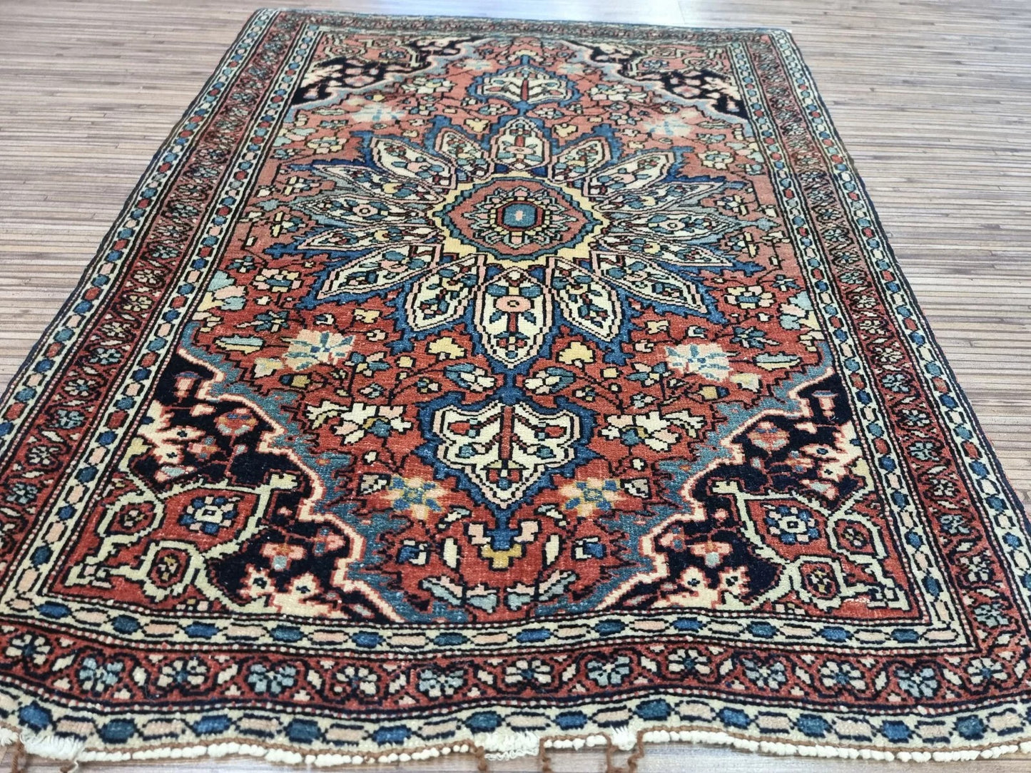 Authentic 19th-century Persian rug featuring classic Oriental motifs
