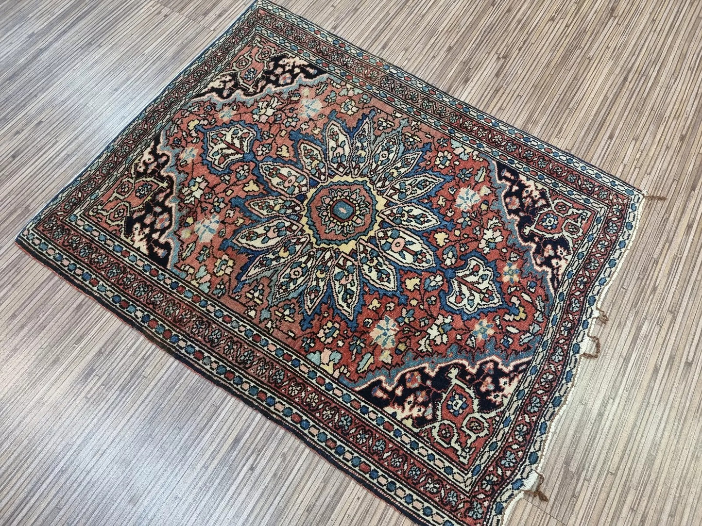 Detailed view of the border design on a handmade Farahan rug from the 1880s
