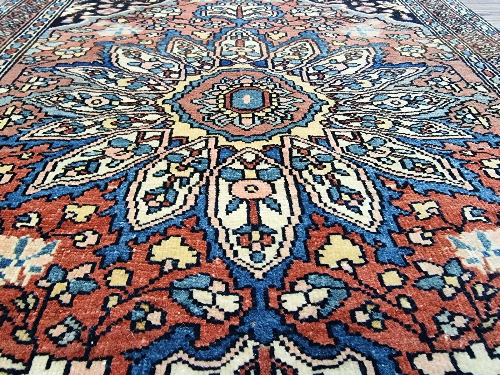 Soft wool texture of an antique Persian hand-knotted rug
