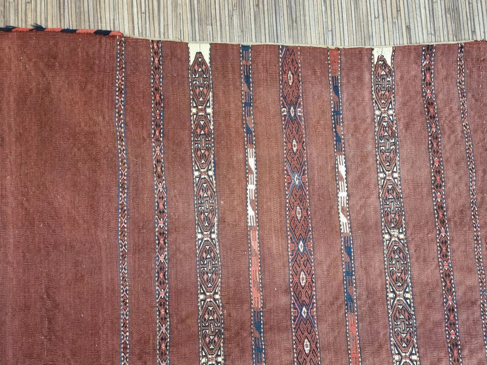 Flatwoven antique wool textile with bold tribal motifs
