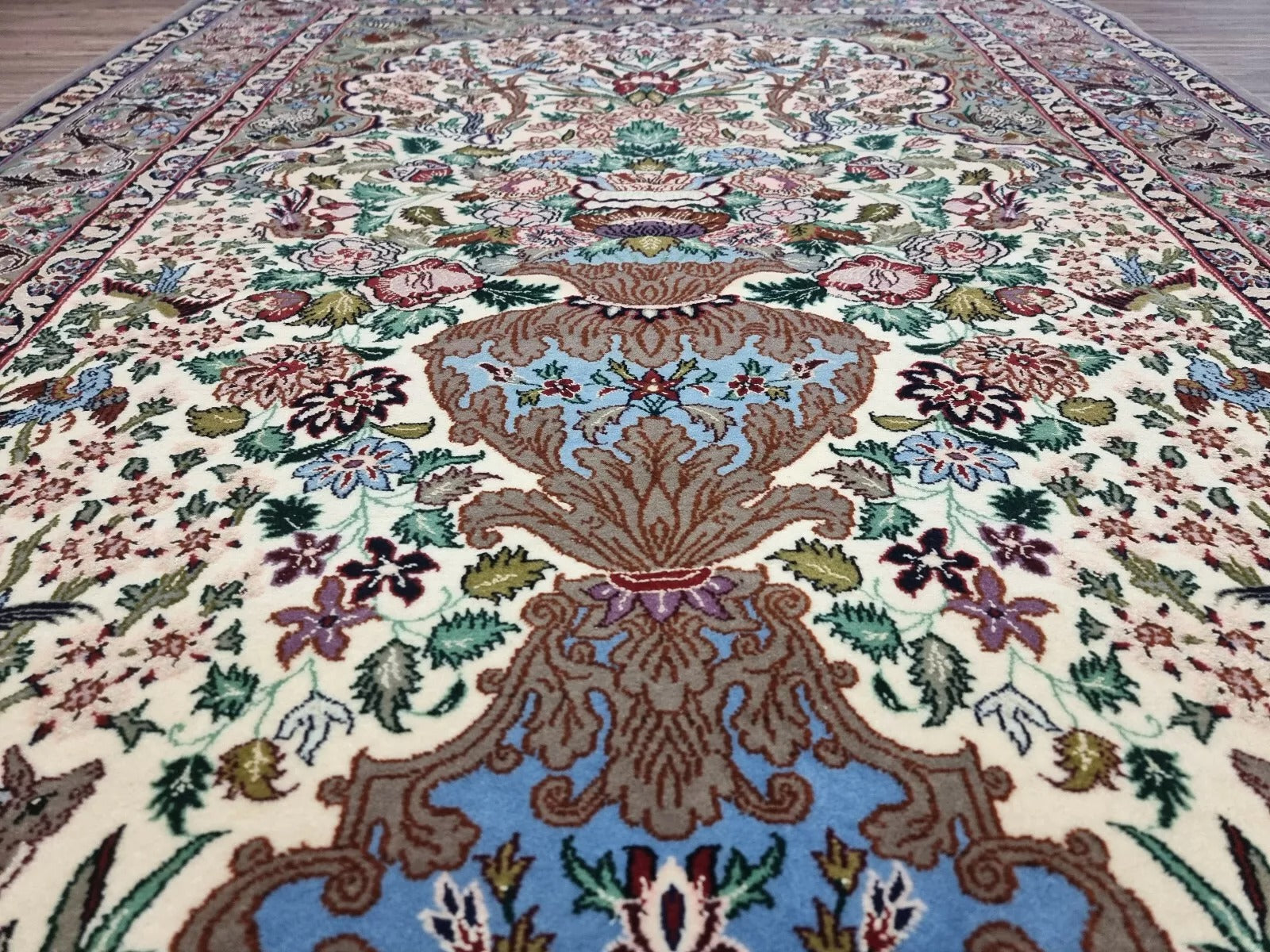 Close-up of intricate floral motifs on an Isfahan kork wool and silk rug
