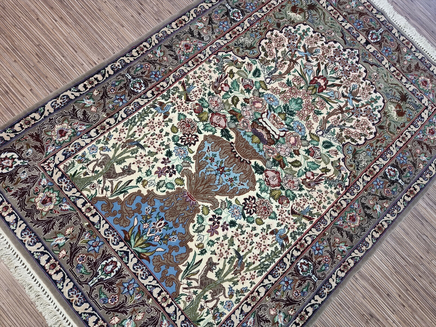 1950s Persian handwoven carpet featuring delicate floral patterns
