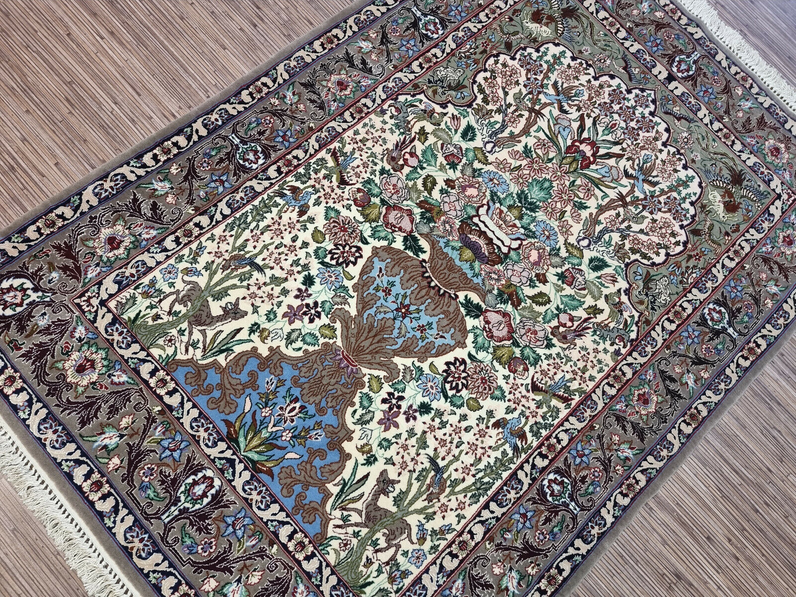 1950s Persian handwoven carpet featuring delicate floral patterns
