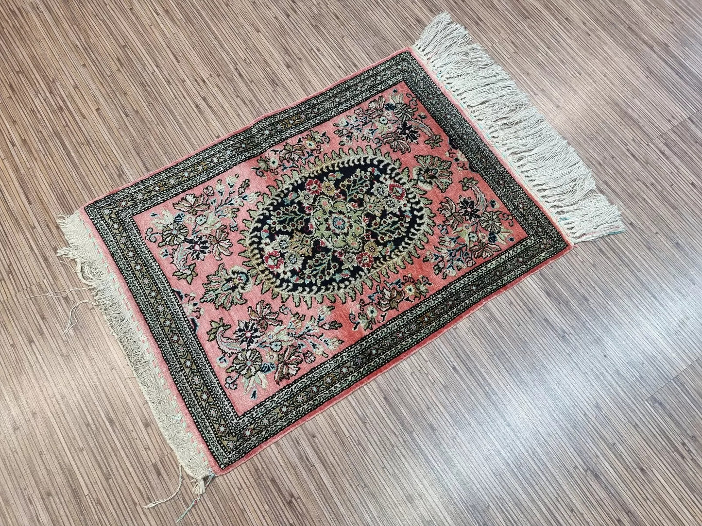 Hand-knotted Persian Qum silk rug with shimmering silk fibers
