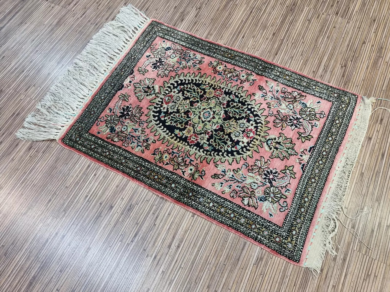 Silk Persian rug with an intricate pattern, ideal for wall display or table décor
