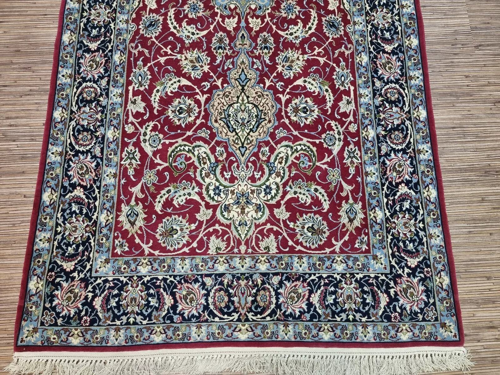 Fine details of a Persian rug, featuring traditional Middle Eastern motifs
