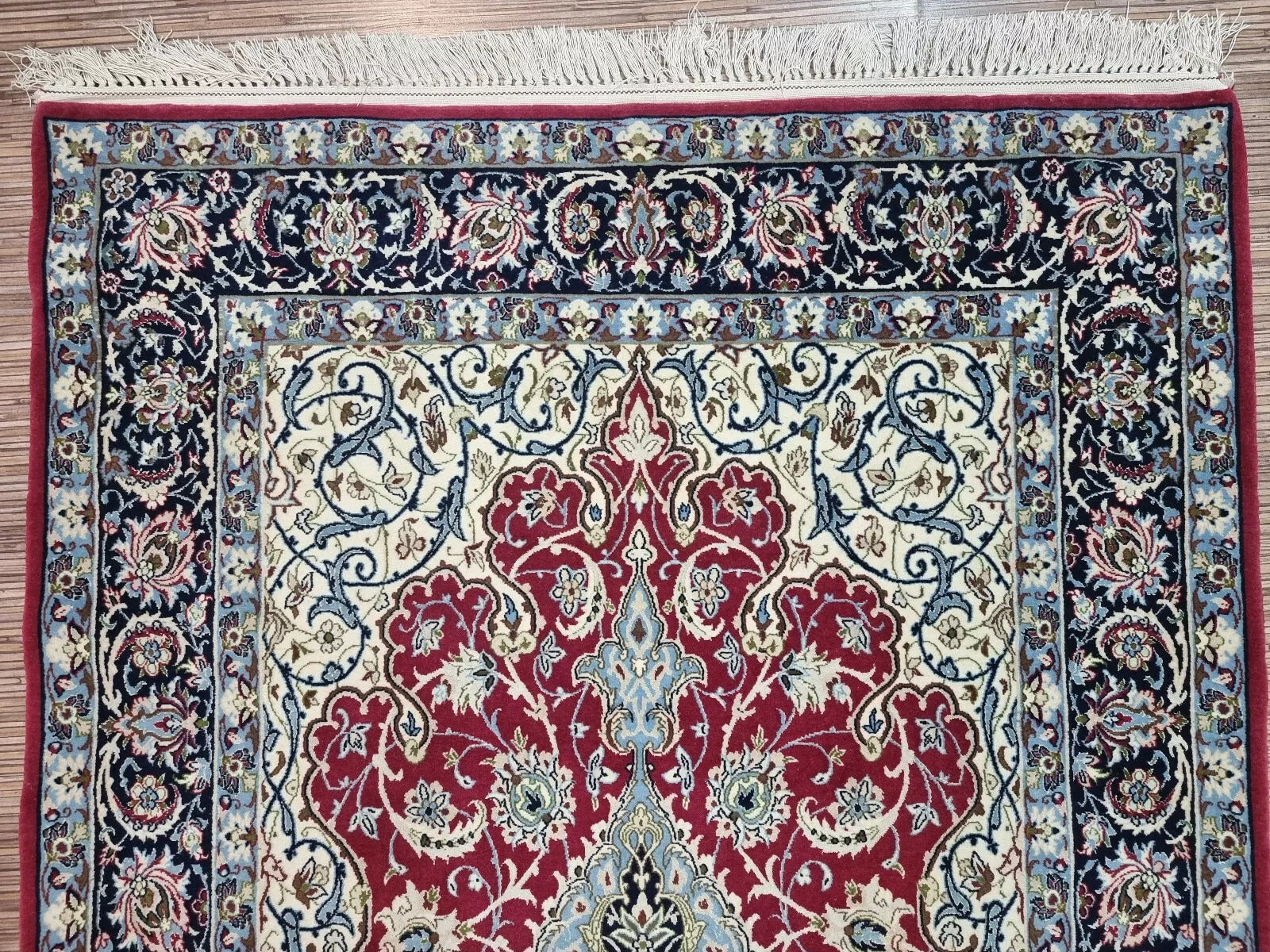 Silk foundation Persian rug with intricate floral patterns, perfect for wall display
