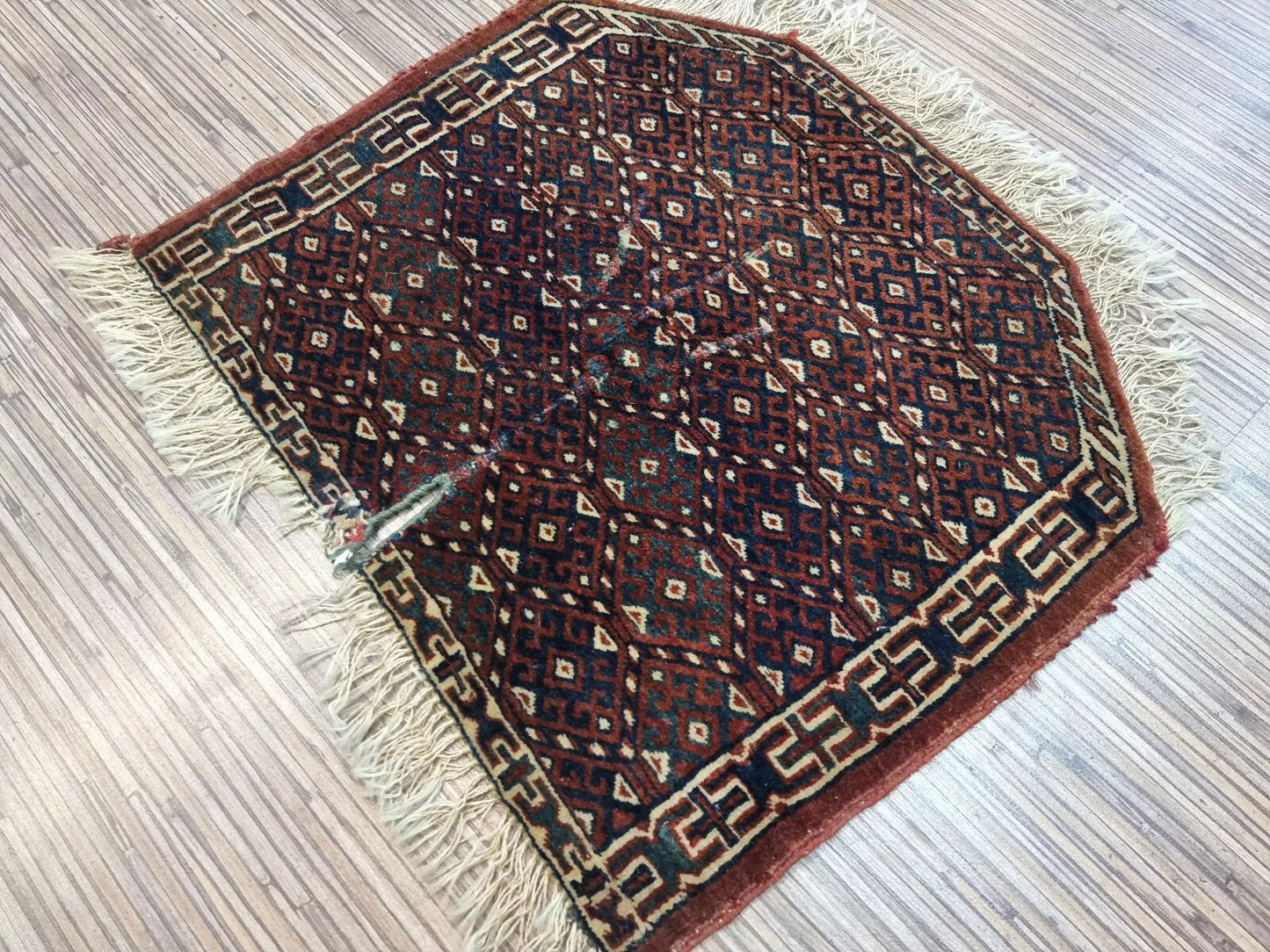 Classic geometric pattern on vintage Yomud rug
