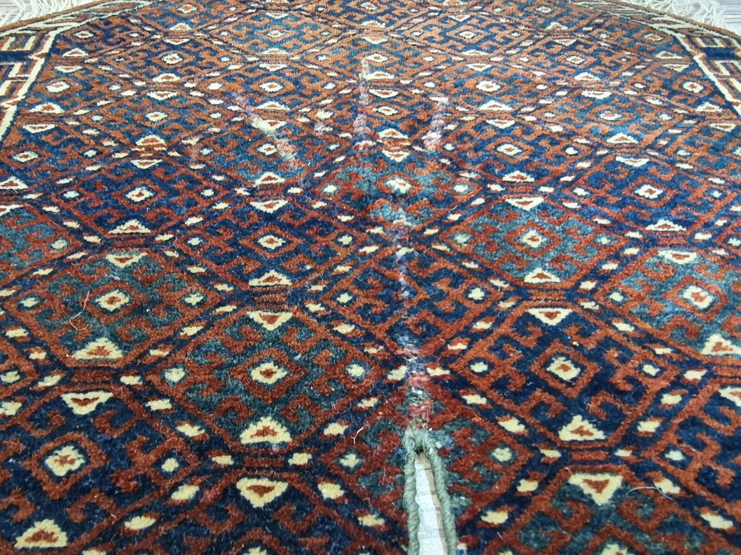 Close-up of hand-knotted wool on Yomud rug
