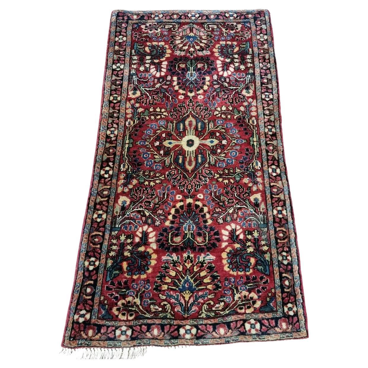 Handmade antique Persian Sarouk rug
