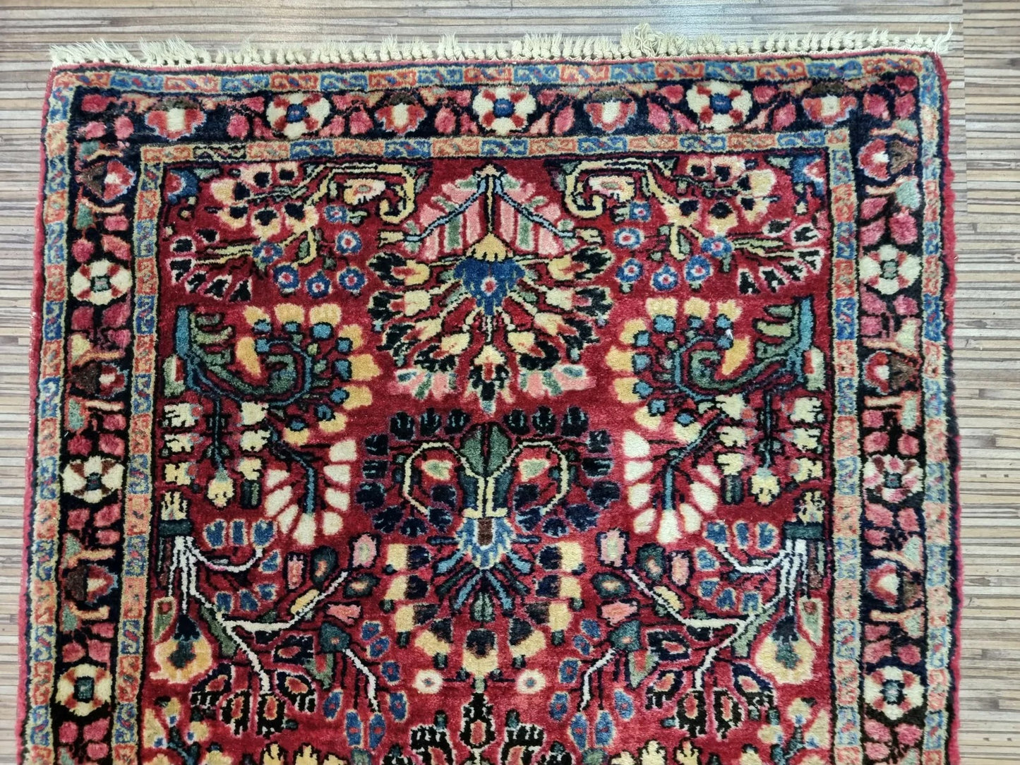 Antique Persian rug red floral motifs
