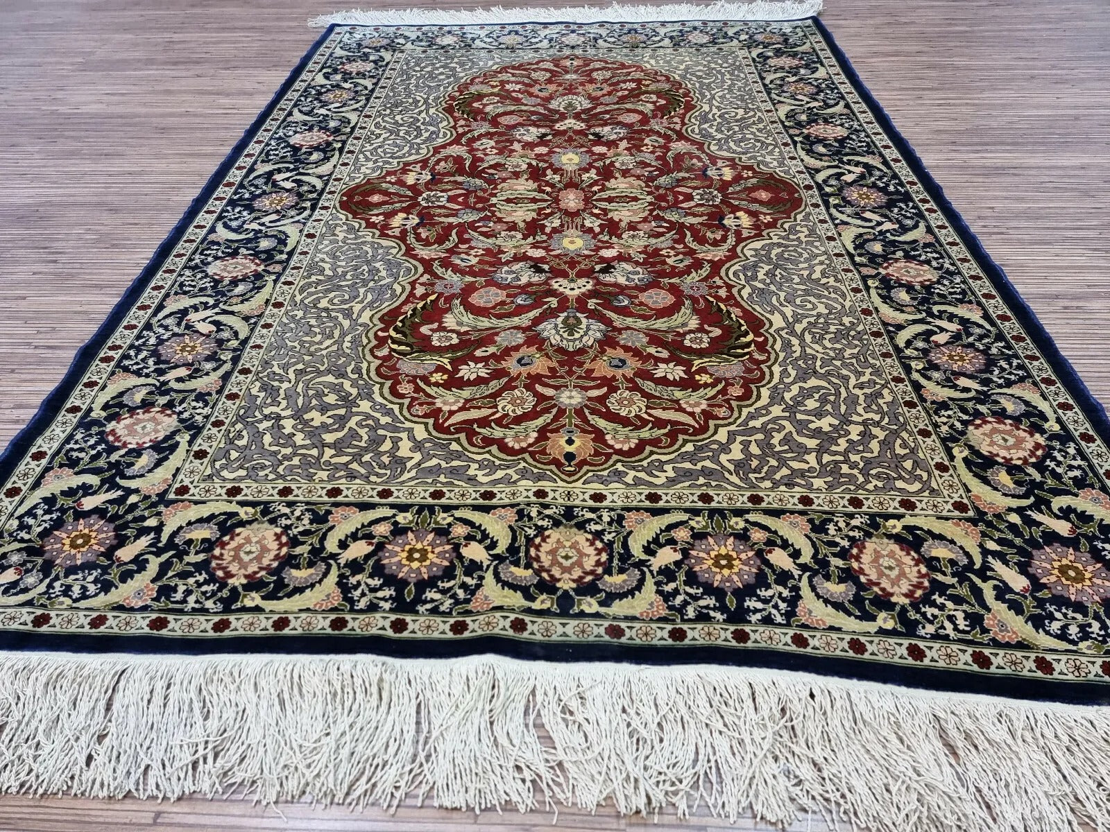 Vintage Hereke rug vibrant red tones
