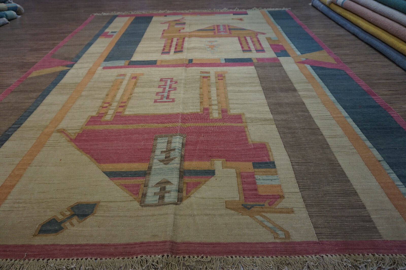 Handwoven artistry: Experience the beauty of Indian textiles in this Vintage Kilim Rug with camels (6.3' x 8.3').