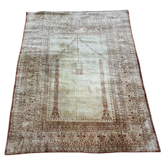 Antique Silk Tabriz Prayer Rug (Early 20th Century): Muted elegance in a captivating central arch design with a hanging lamp motif. (4' x 5.2')