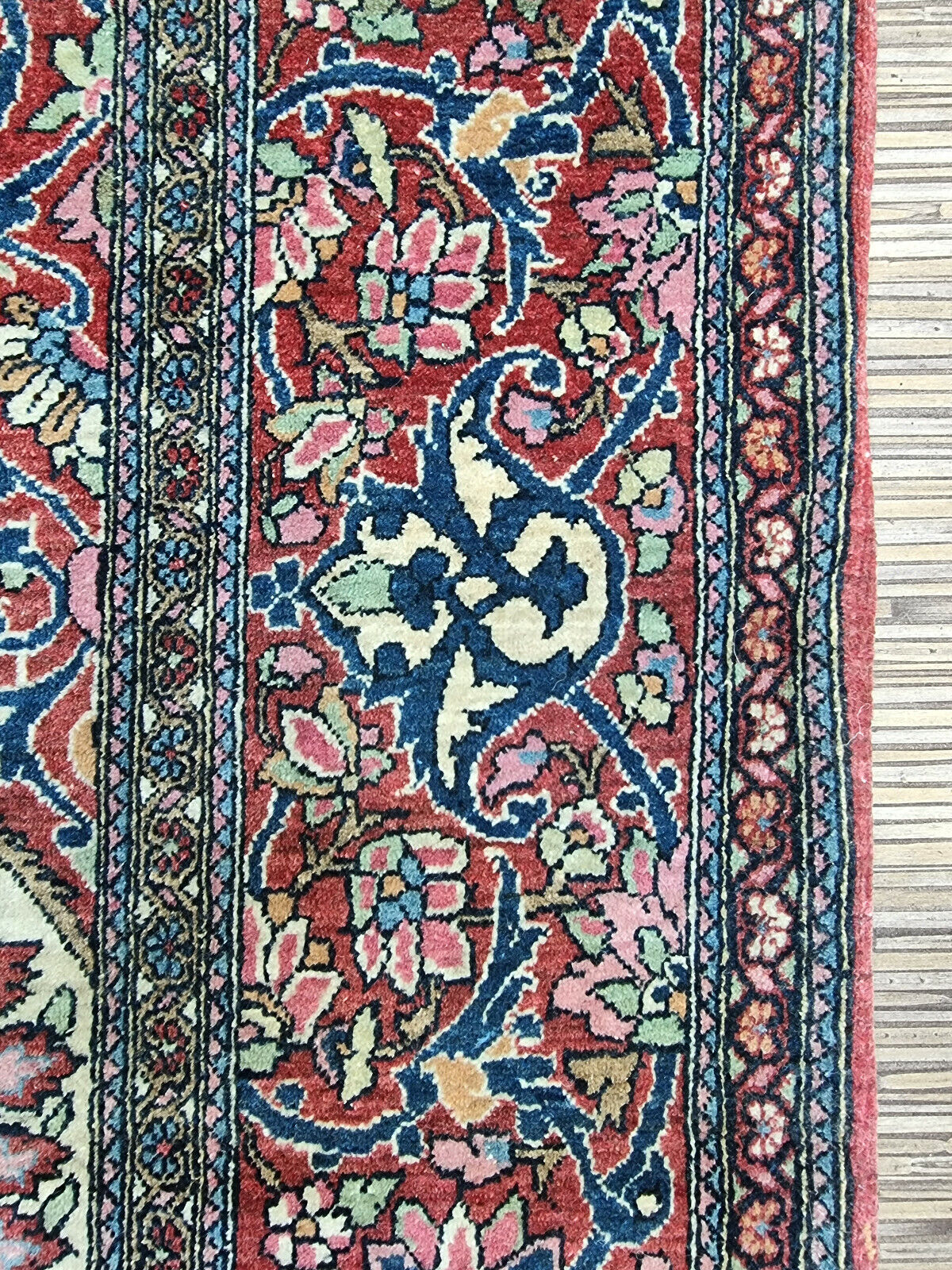 Vintage Wool Isfahan Prayer Rug (1900s): Invest in a piece of history with this captivating Isfahan prayer rug. (Close-up of section in a styled setting)