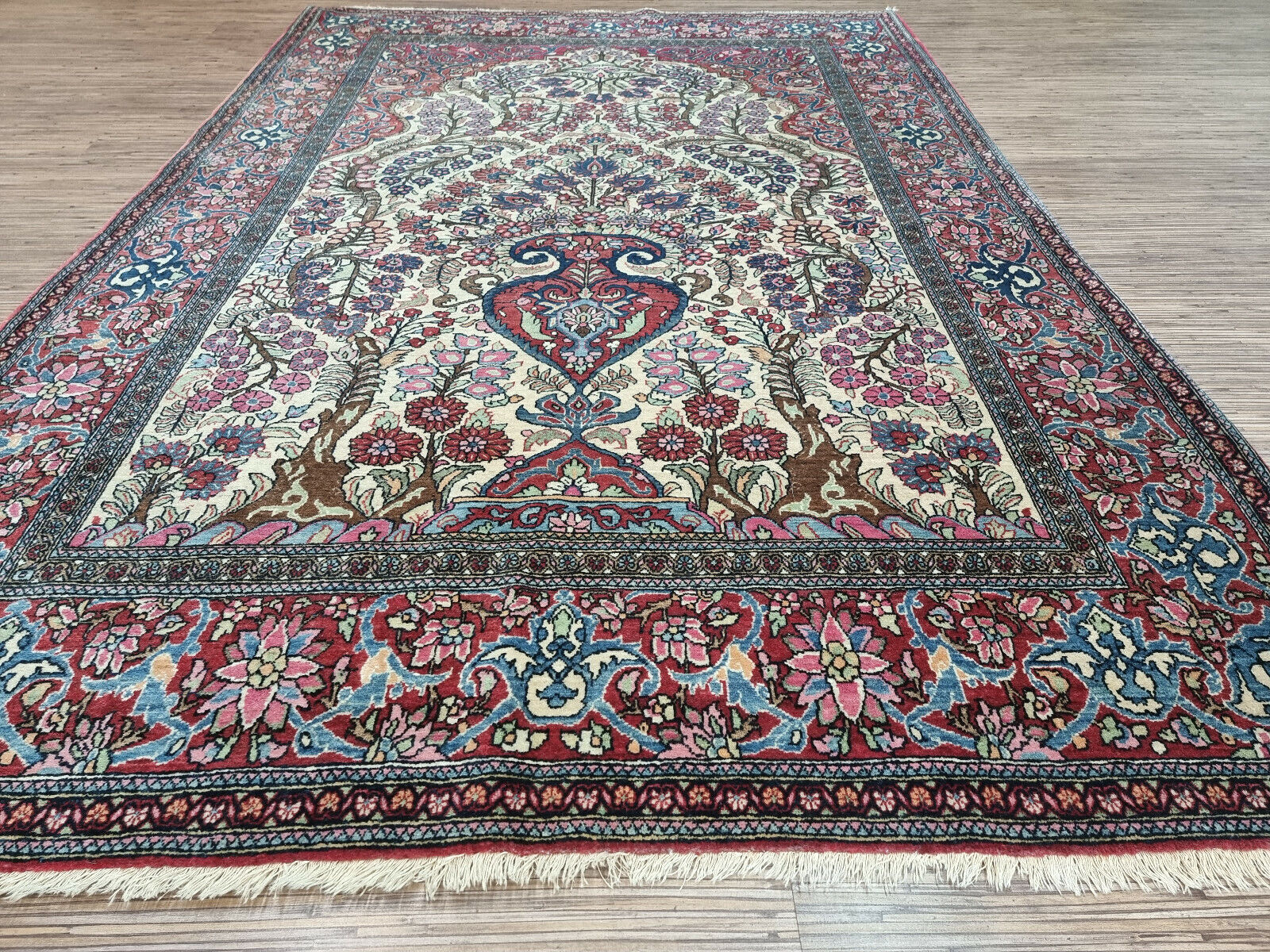 Vintage Wool Isfahan Prayer Rug (1900s): Vibrant color palette of reds, blues, and creams creates a visually striking design. (Close-up)