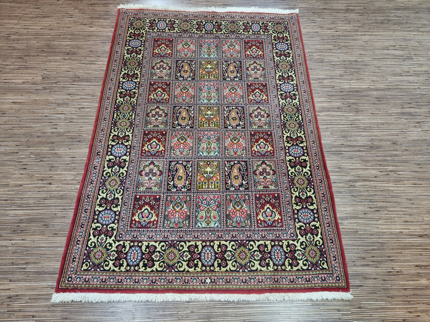 A Touch of Luxury: Enhance your space with this Handmade Vintage Persian Style Qum Rug (3.6' x 5.1').