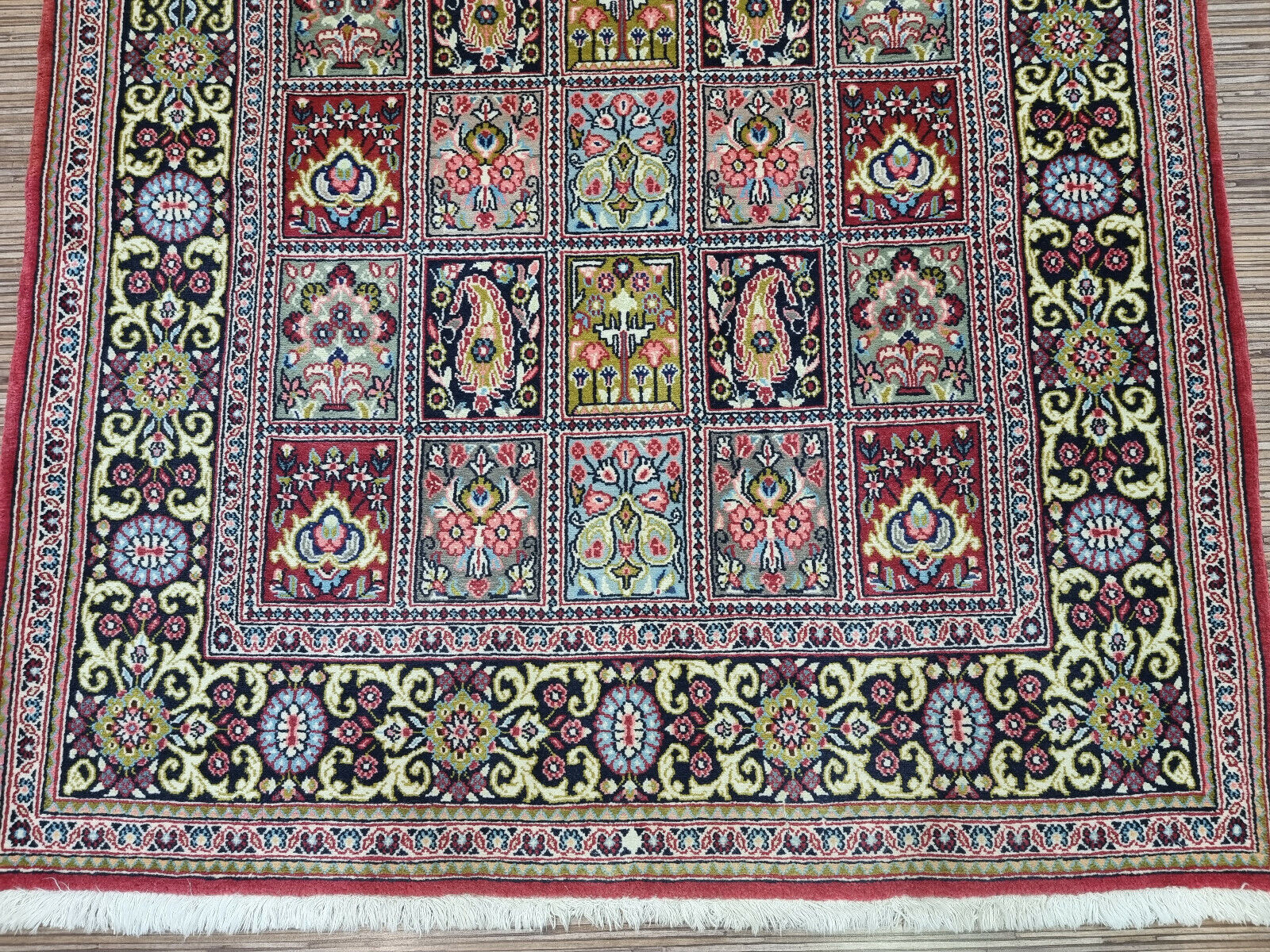 Vintage Charm for Modern Living: Handwoven Persian Rug (3.6' x 5.1') in a captivating geometric & floral design (reds, blues).