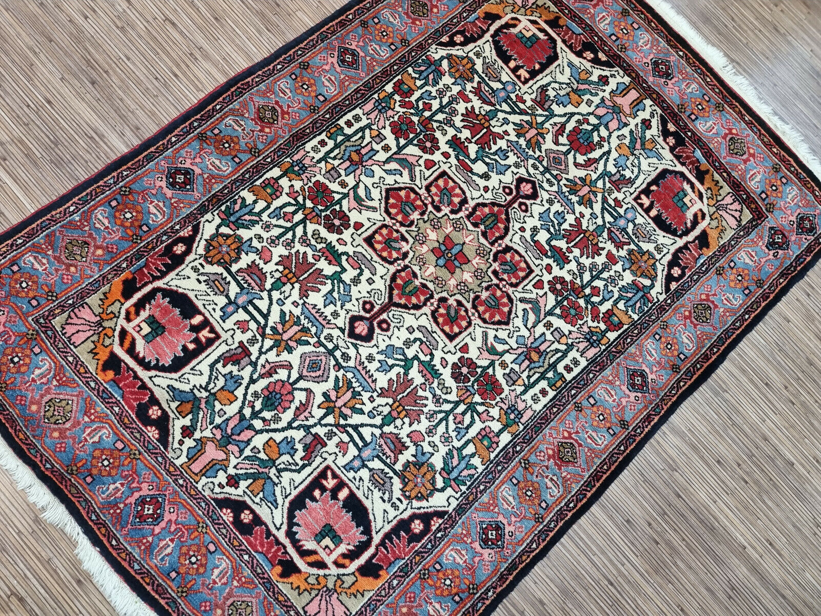 Step Back in Time: Handwoven Vintage Bidjar Rug (3.4' x 5') boasts a symmetrical design and rich color palette (1970s).