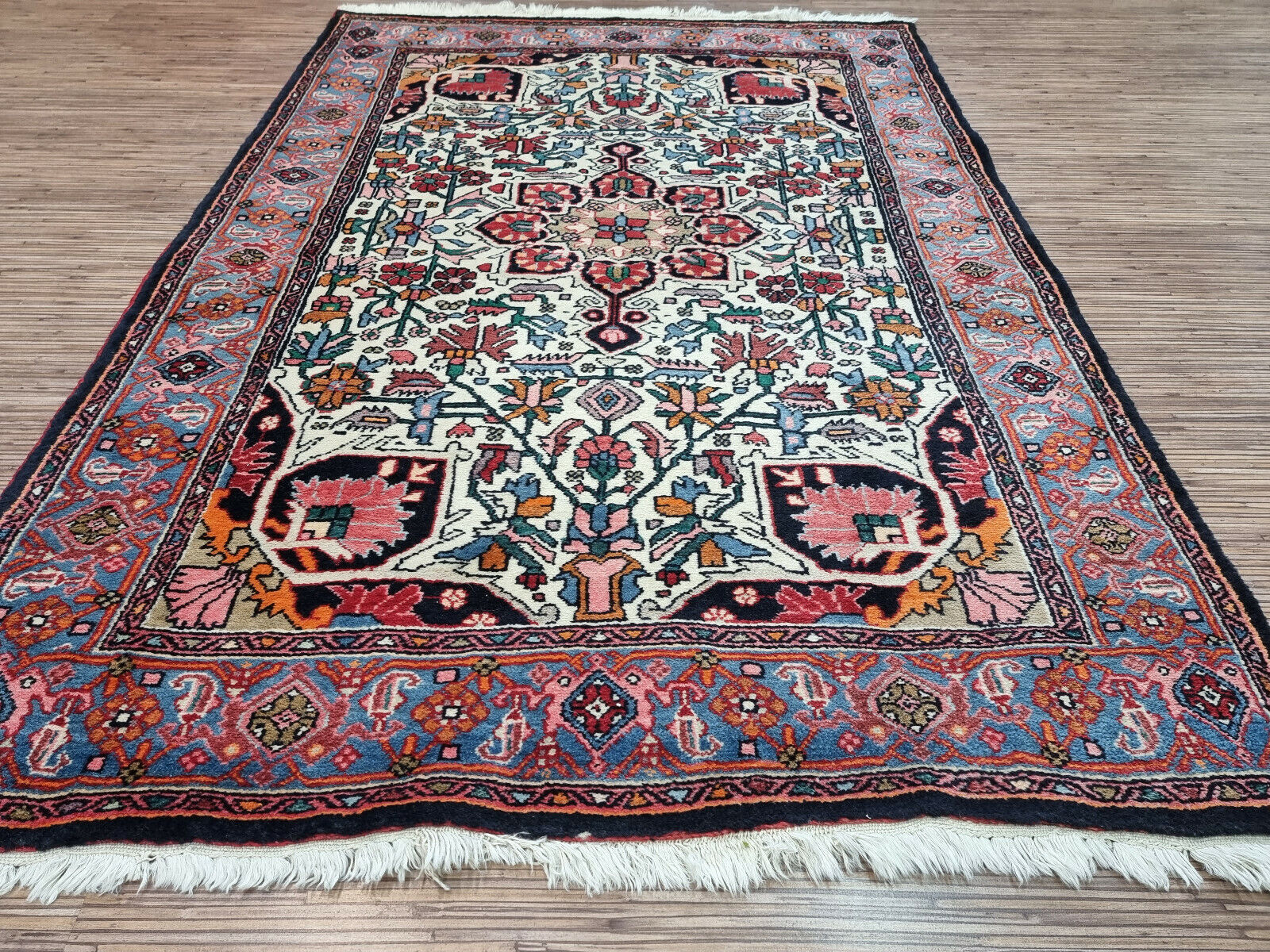 Art for your Floor: Vintage Bidjar Rug (3.4' x 5') - a captivating blend of geometric & floral patterns in a vibrant colorway.