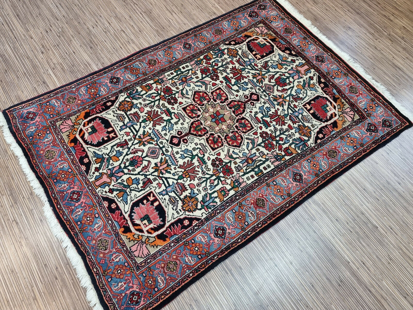 Traditional Elegance: Handwoven Wool Rug (3.4' x 5') in Bidjar style with geometric & floral motifs (blues, reds, whites).