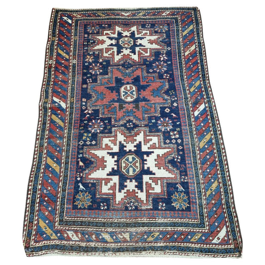 Journey Through Time: Immerse yourself in the rich heritage of Caucasian rug making with this captivating Antique Shirvan Rug (3.4' x 5.2').