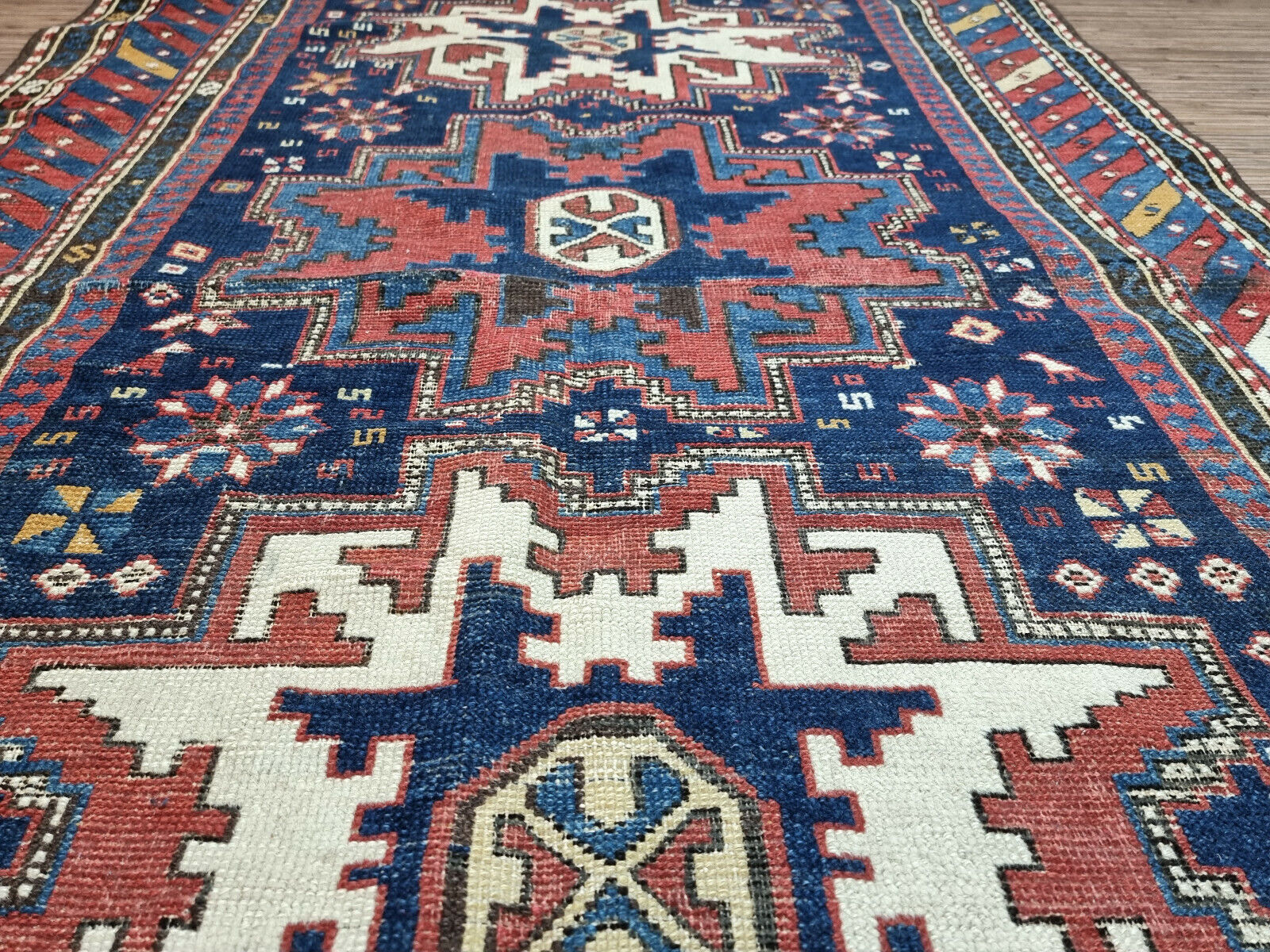 Low Pile Wool Rug for Comfort: Enjoy the comfort and durability of this low pile wool Antique Shirvan Rug.