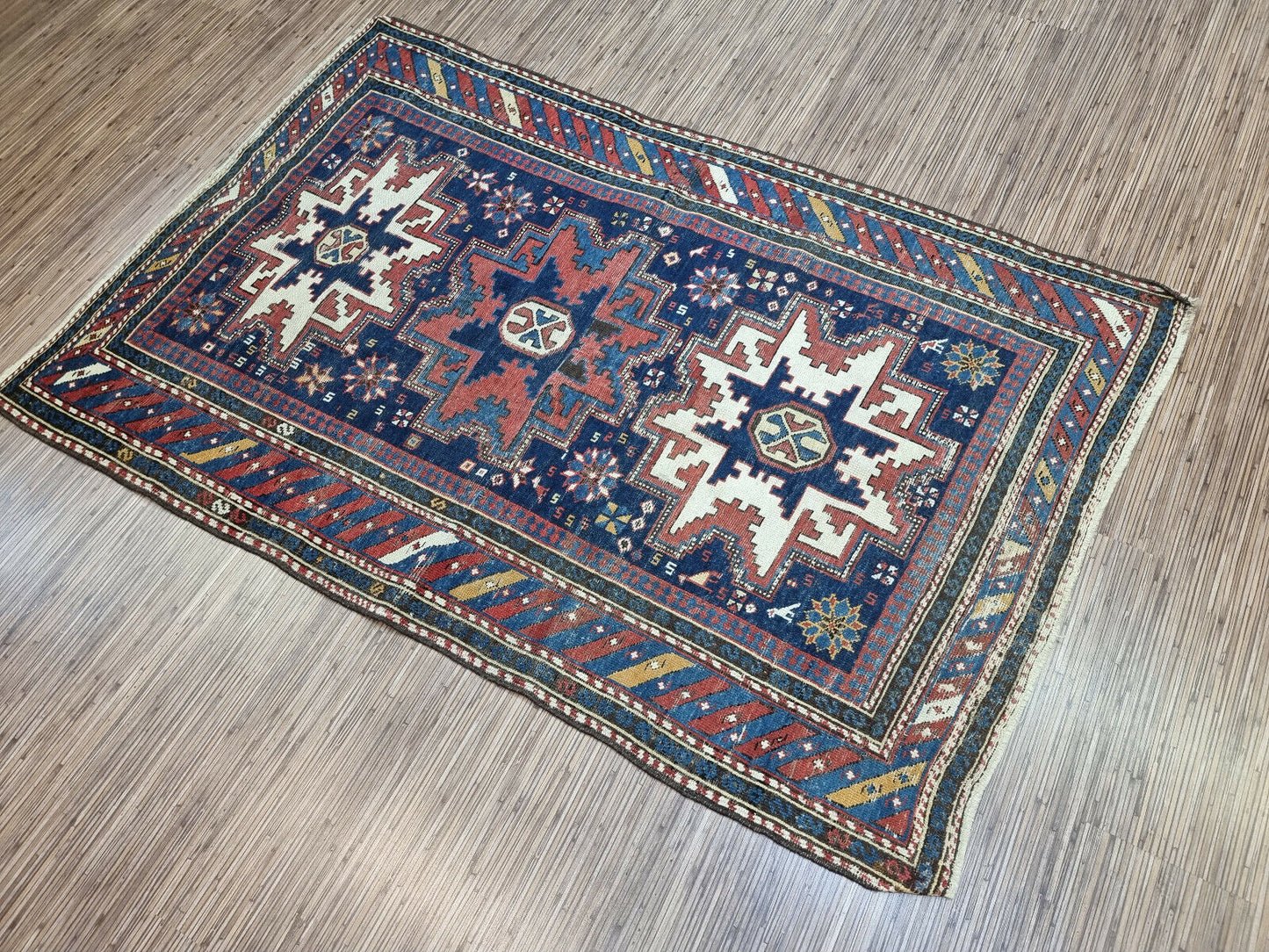 Handmade Heirloom: Handwoven in the 1900s, this Antique Shirvan Rug is a testament to timeless craftsmanship.