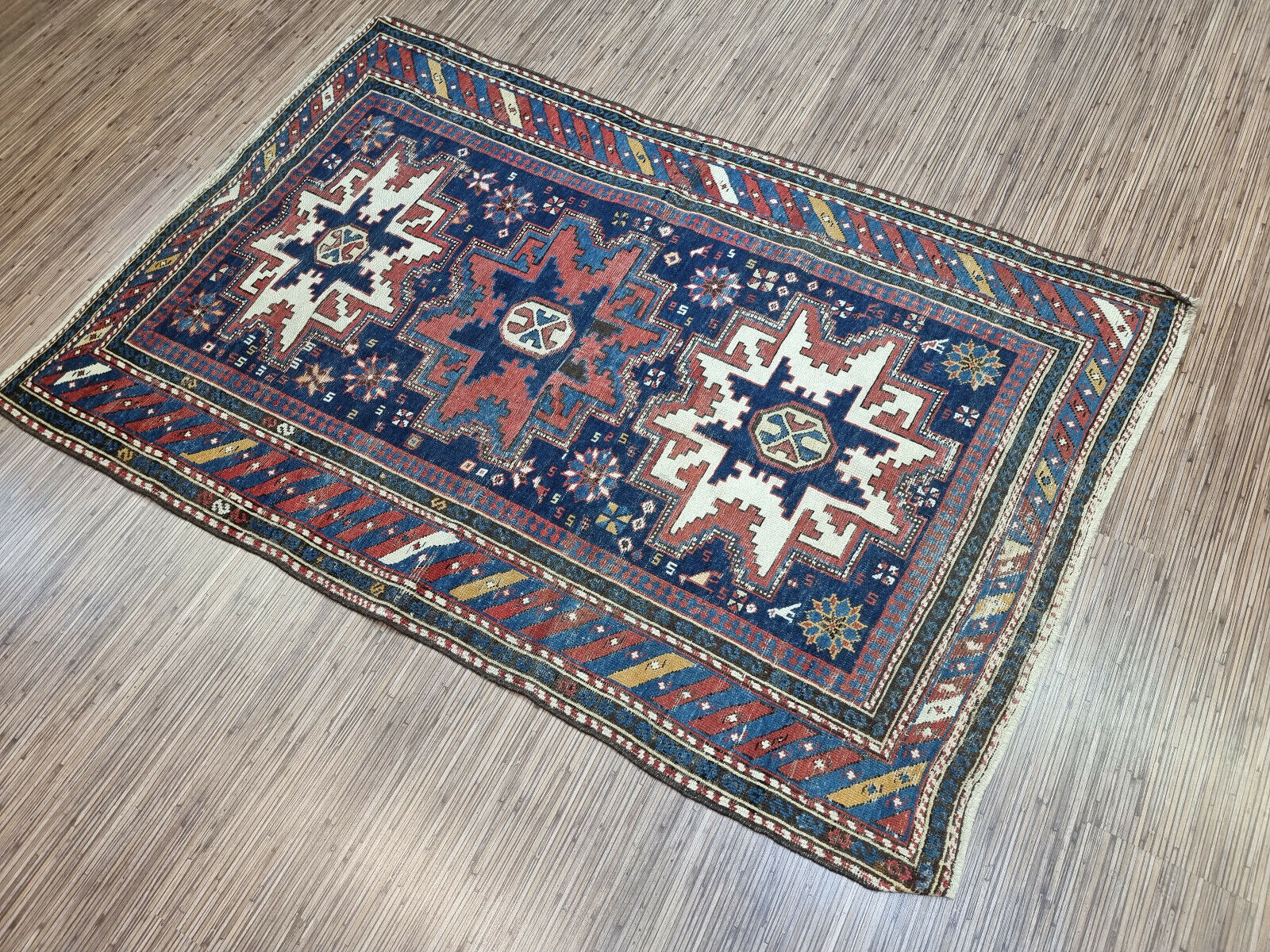 Handmade Heirloom: Handwoven in the 1900s, this Antique Shirvan Rug is a testament to timeless craftsmanship.