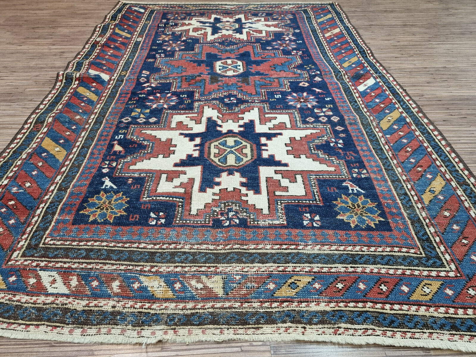 Authentic Beauty: Subtle signs of age add to the charm and authenticity of this Antique Shirvan Rug.