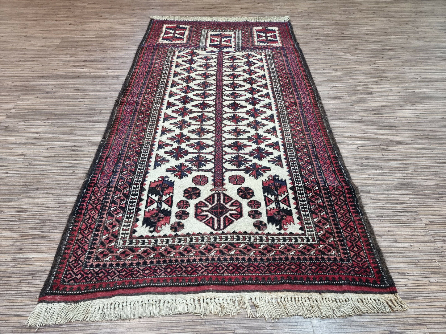 Cream, Red, and Blue Symphony: Vintage Baluch Prayer Rug (2.7' x 5.5') boasts a striking color contrast and intricate design.