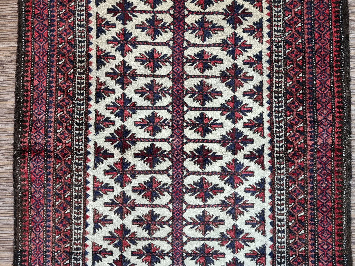 Timeless Design: Vintage Afghan Baluch Prayer Rug (1950s) features a classic geometric design that complements any décor.