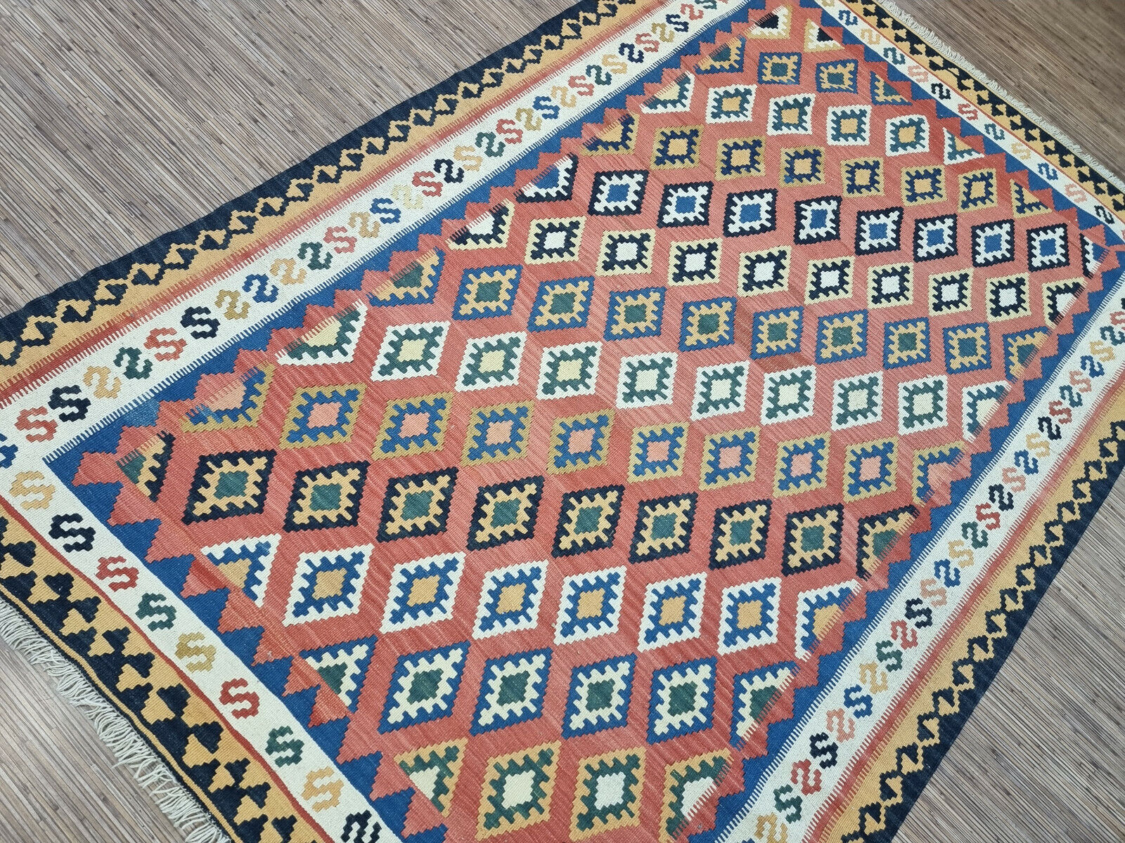 Kaleidoscope of Color: Flatweave Wool Rug (4.9' x 7.2') in Persian Ardabil style with geometric patterns.