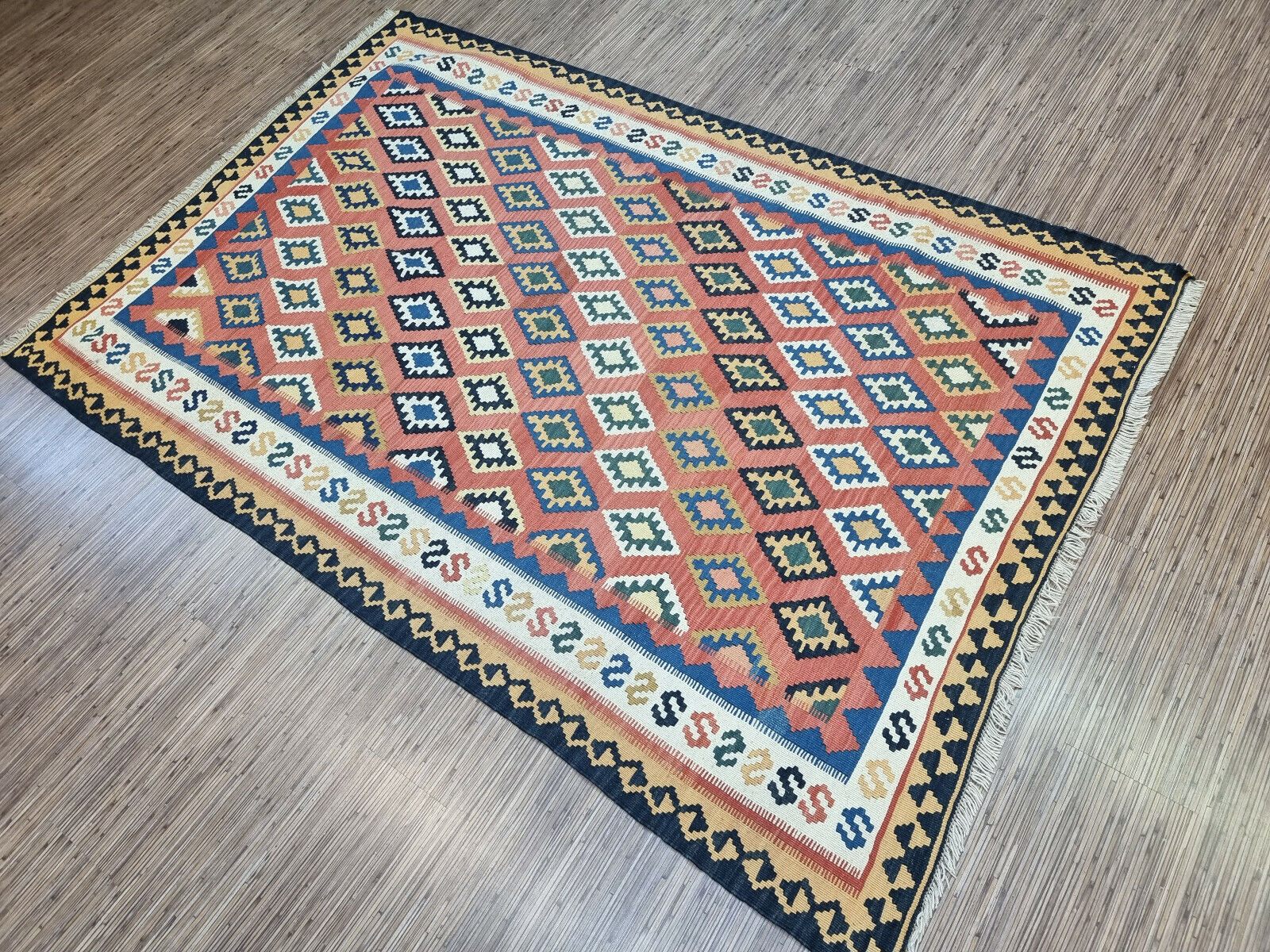 Step Back in Time: Handwoven Vintage Kilim Rug (Persian Ardabil Style) boasts a rich history and intricate design (1970s).