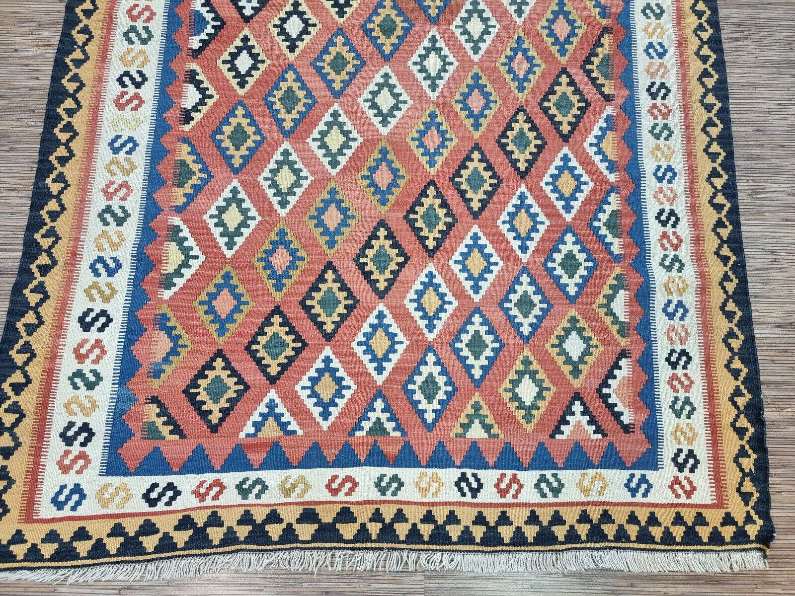 Handwoven Persian Artwork: Invest in a piece of art: Vintage Ardabil Kilim Rug (1970s) with intricate geometric patterns.