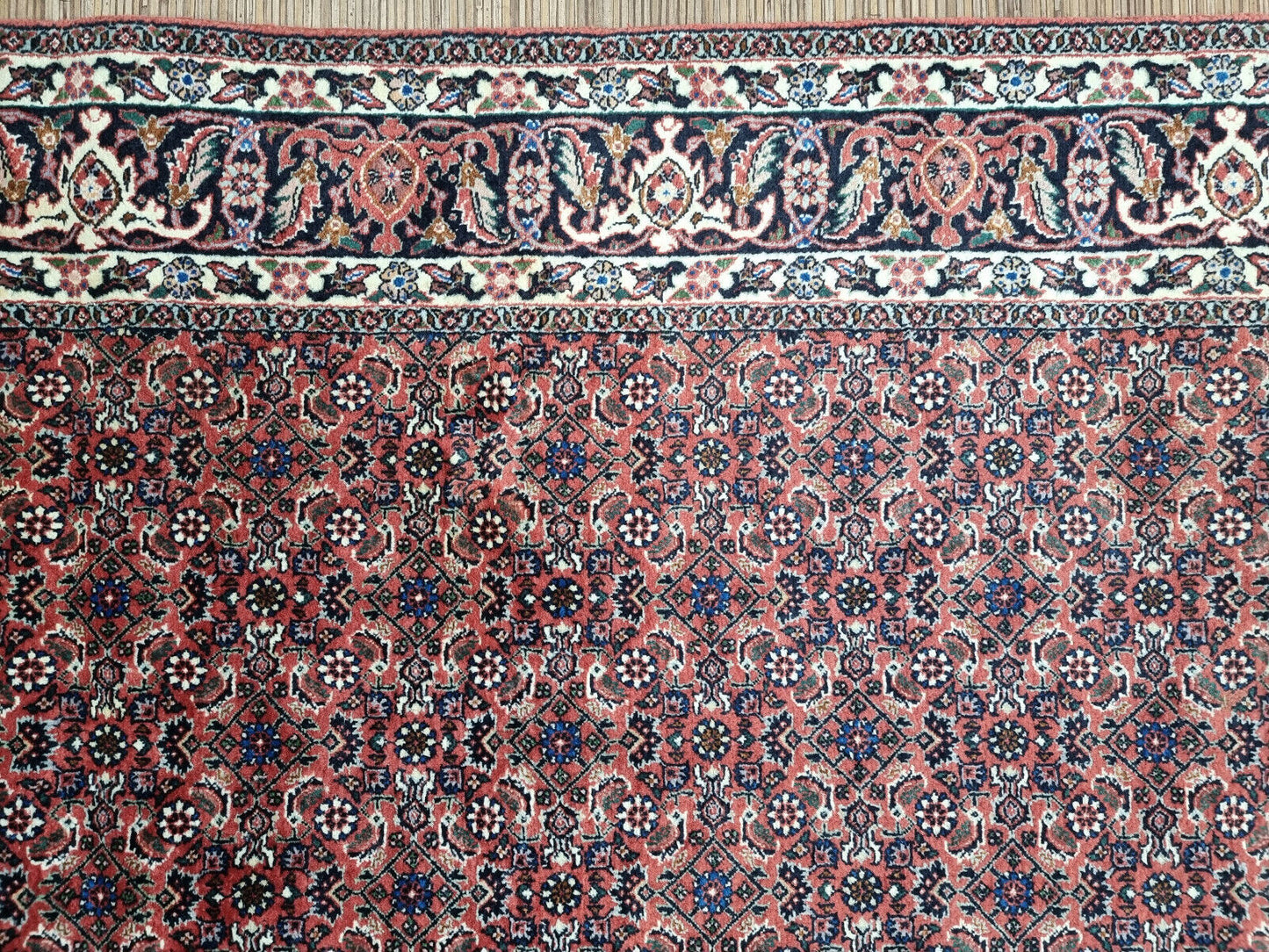 Bedroom Rug: A Touch of Opulence: Add a touch of opulence to your bedroom with this captivating Persian Bidjar rug, featuring intricate details and a luxurious feel.