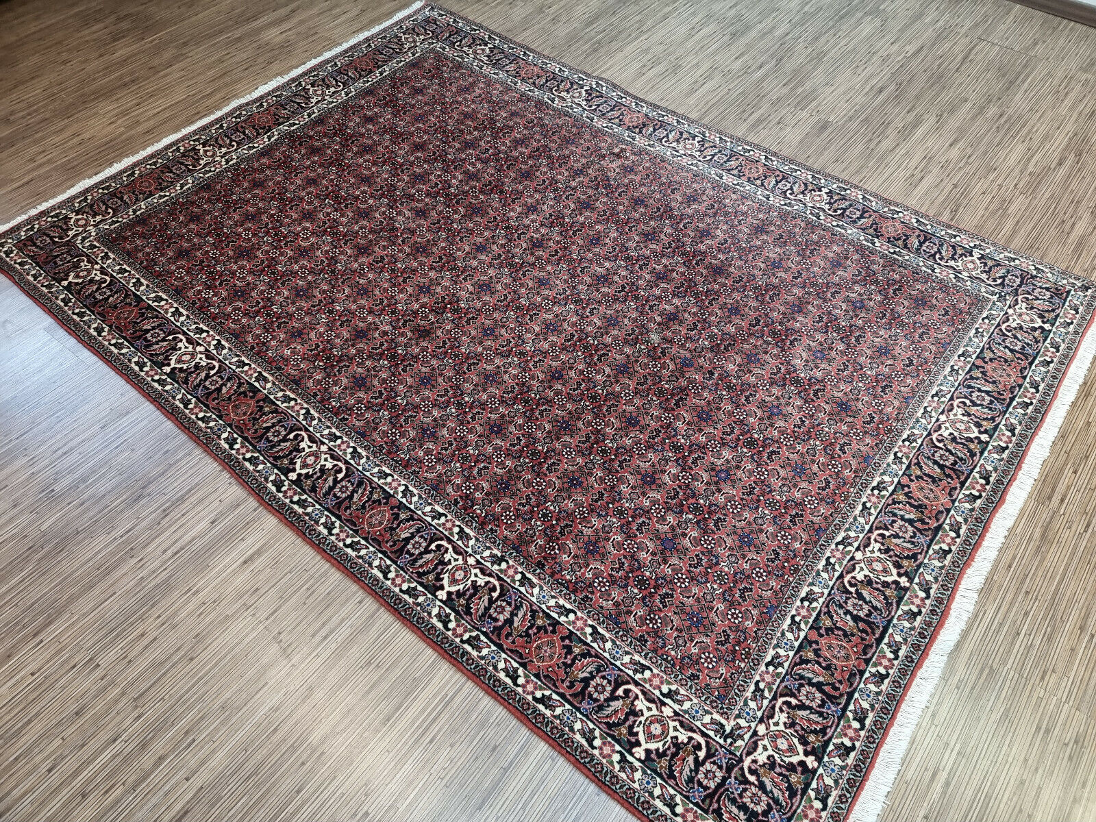 Large Persian Rug: A Statement Piece: Create a captivating focal point in your grand room with this large handwoven Persian Bidjar rug, measuring 5.7' x 7.8'.