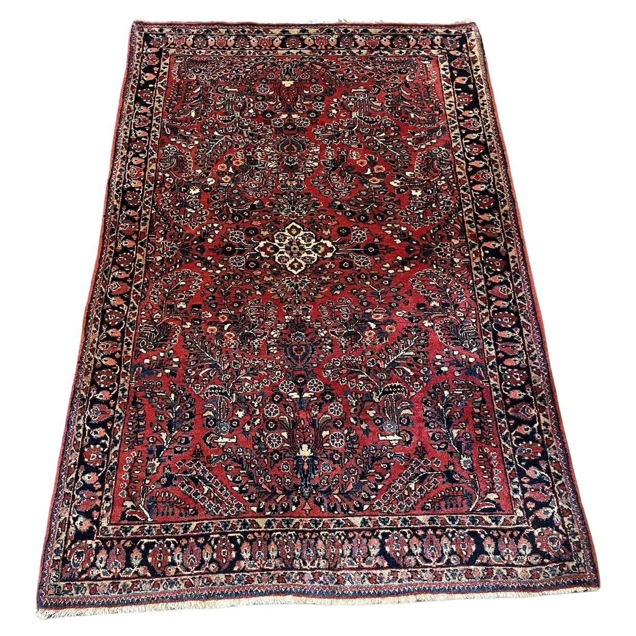 Handmade Antique Persian Sarouk Rug with Floral Patterns
