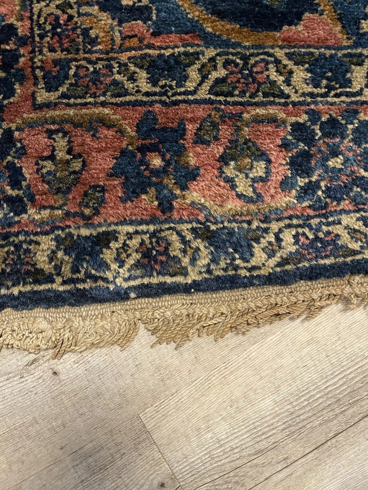 Handwoven Antique Wool Rug with Traditional Persian Designs
