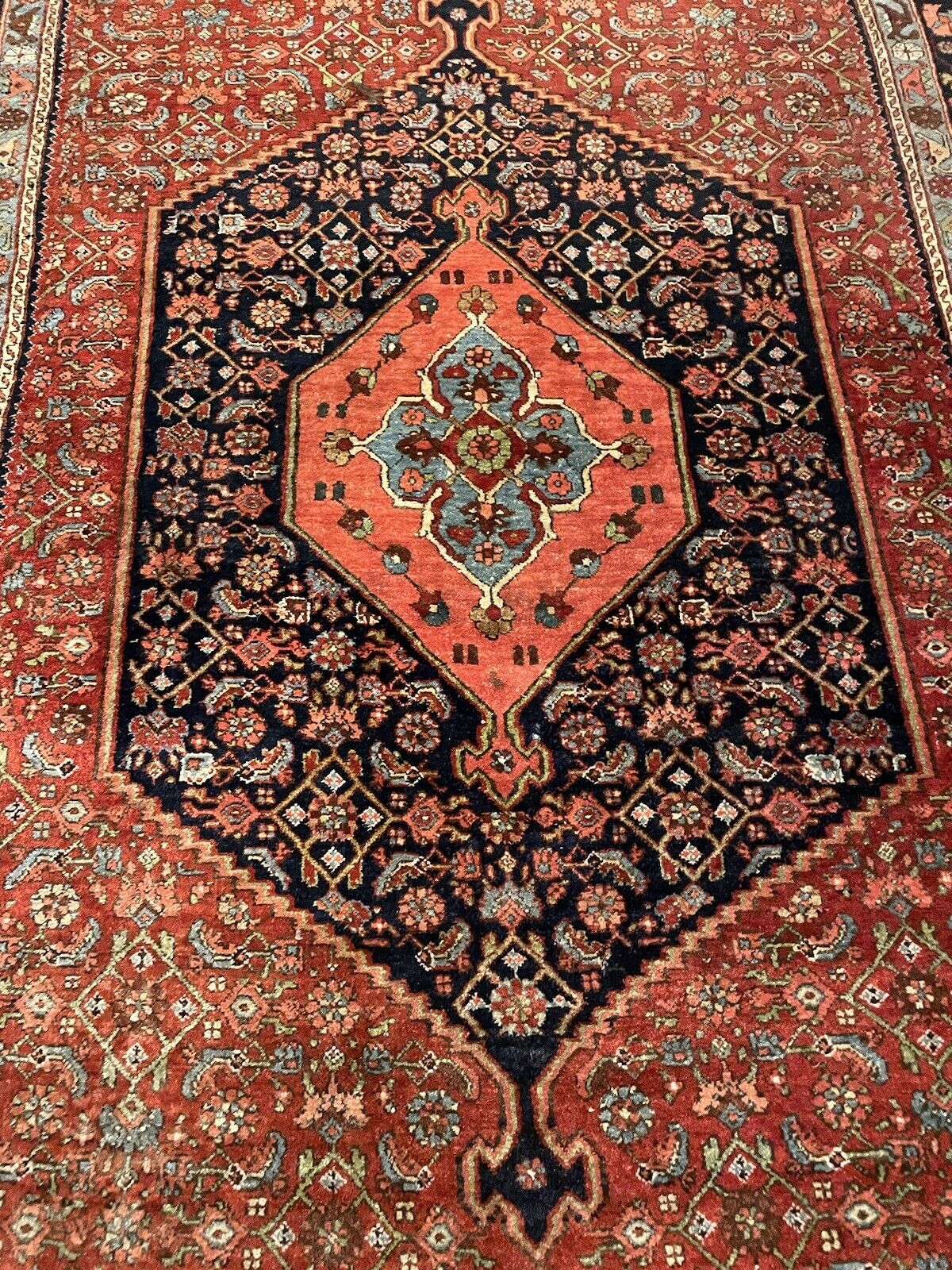 Close-up of antique Bidjar rug’s detailed medallion design
