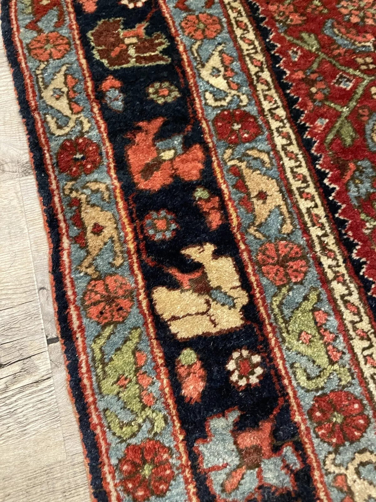 Traditional handmade Bidjar rug in deep red and black hues
