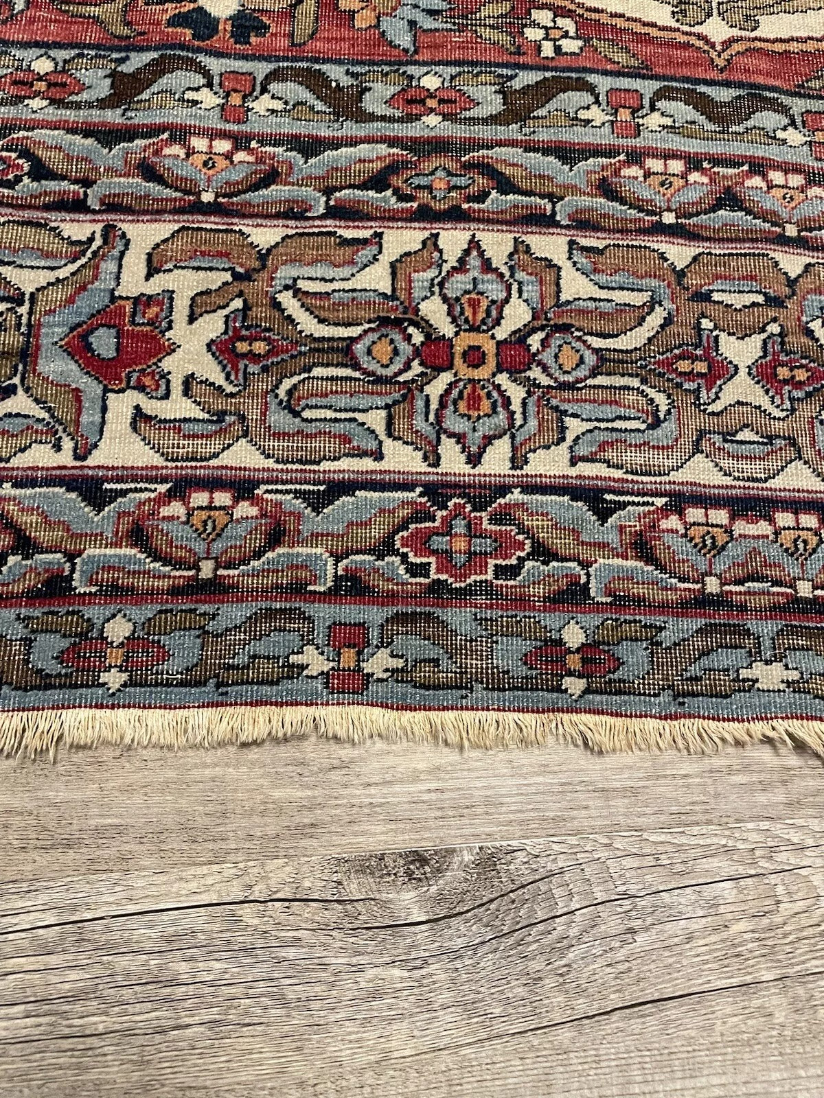 Vintage Kerman Lavar rug with intricate floral and geometric patterns
