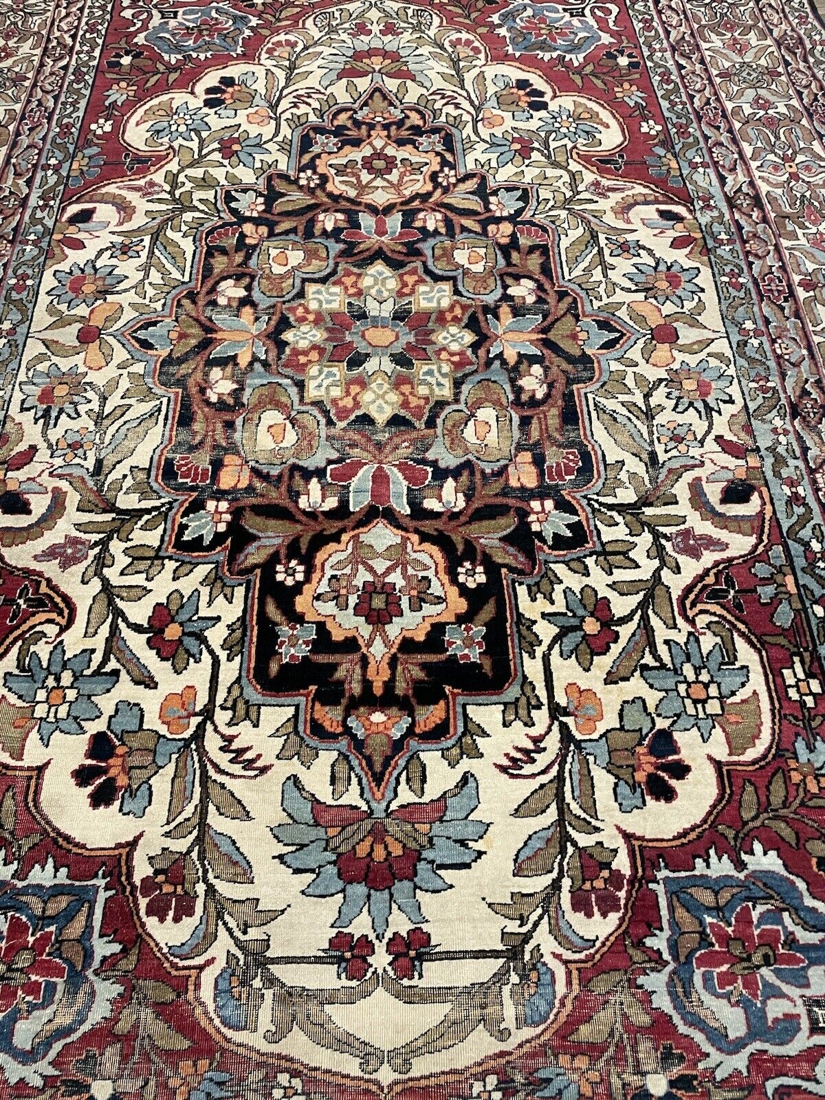 Elegant 1880s handmade Kerman Lavar rug with rich colors
