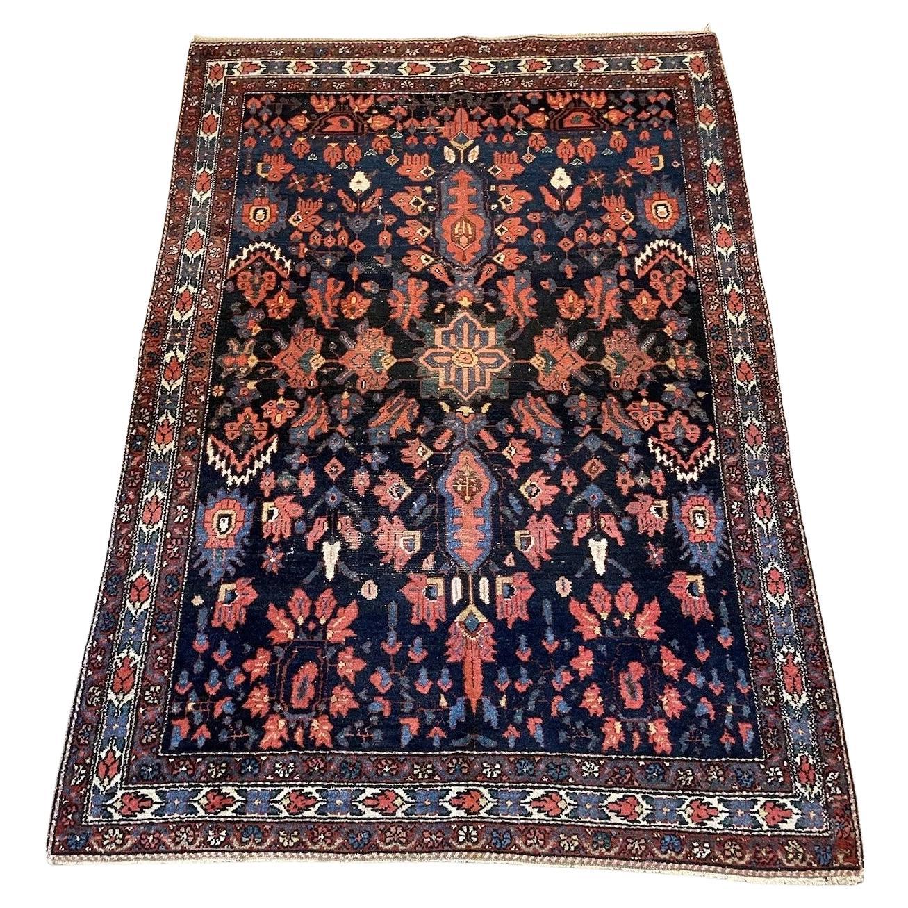 Handmade antique Bakhtiari wool rug from the 1920s, 4.4' x 6.4'
