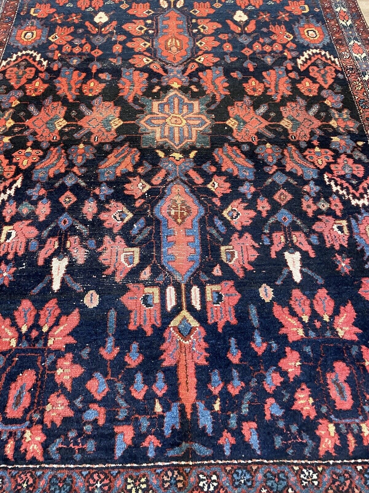 Antique Bakhtiari carpet showcasing classic craftsmanship
